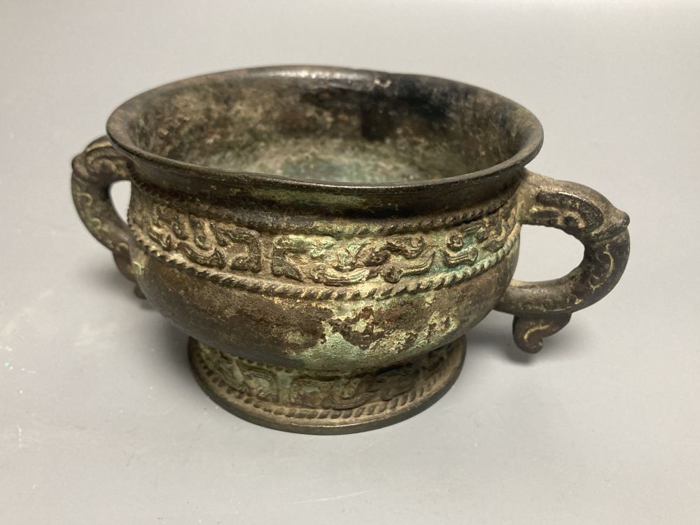 An 18th century Chinese archaistic bronze two handled censer, 16.5cm handle to handle